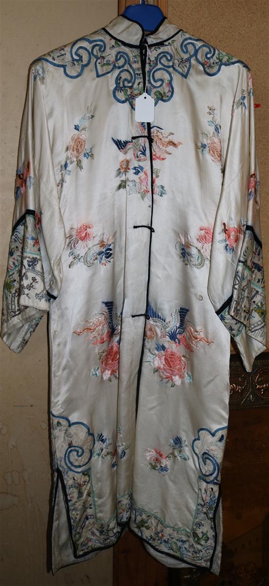 Chinese Mandarin coat, circa 1930s, embroidered with dragons, flowers, rural scenes, etc on ivory silk